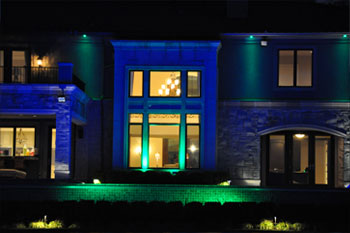 close up back exterior at night of Mercer Island Pulsar ChromaBump MR16 Residence using LED architectural lighting