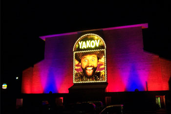 Yakov Smirnoff Show building lit red blue purple at night using City Color 2500 and Dominator architectural lights from Studio Due
