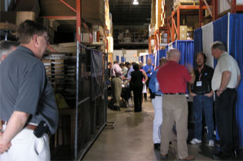 guest watching lightshow in showroom at the Rental & Staging Roadshow 2008 hosted by Techni-Lux, Orlando, Florida USA