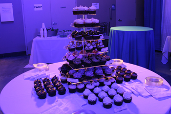 dessert table with various flavored cupcakes displayed on 5 tiered stand Techni-Lux Technology Day 2018, Orlando, Florida USA