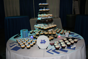 dessert table with various flavored cupcakes displayed on 5 tiered stand Techni-Lux 25th Anniversary Open House 2016, Orlando, Florida USA