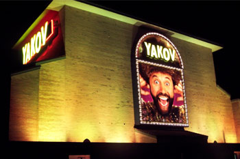 Yakov Smirnoff Show building lit yellow at night using City Color 2500 and Dominator architectural lights from Studio Due