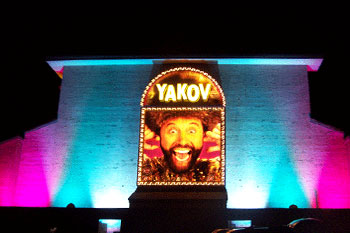 Yakov Smirnoff Show building lit aqua pink at night using City Color 2500 and Dominator architectural lights from Studio Due