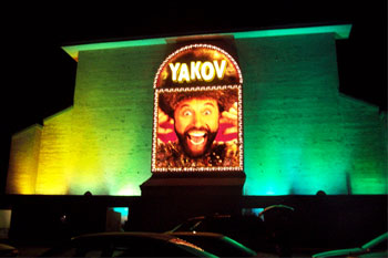 Yakov Smirnoff Show building lit green yellow at night using City Color 2500 and Dominator architectural lights from Studio Due