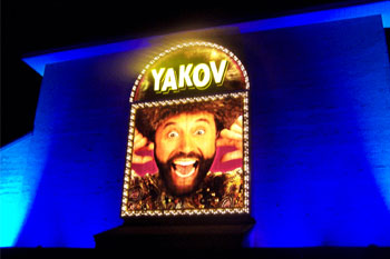 Yakov Smirnoff Show building lit blue aqua at night using City Color 2500 and Dominator architectural lights from Studio Due