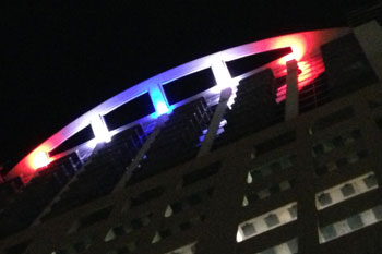 Solaire at the Plaza Condos of Orlando at night with red white and blue Quadro 24 LEDs