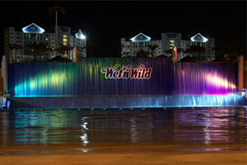 SGM Palcos vibrant LED colors of blue greens and purple pink on Waterfall, Surf Lagoon, Wet 'n Wild Orlando Water park (Closed December 31, 2016), Orlando, Florida USA