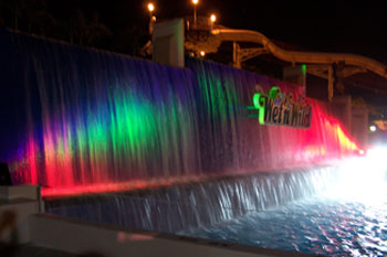 close up of vibrant LED colors of blue green, purple pink and bright white on Waterfall ausing SGM Palcos, Surf Lagoon, Wet 'n Wild Orlando Water park (Closed December 31, 2016), Orlando, Florida USA