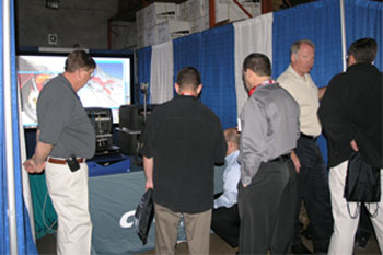 Christie light reps showing guests new products at the Rental & Staging Roadshow 2008 hosted by Techni-Lux, Orlando, Florida USA