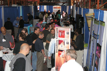 Warehouse full of guests looking at booths at the Rental & Staging Roadshow 2009 hosted by Techni-Lux, Orlando, Florida USA