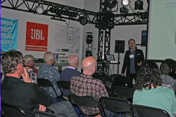 Tguests in showroom listening to seminar Protecting The Stage by guest speaker Richard Cadena, ETCP RT/CE, Technology Day 2018, Orlando, Florida USA