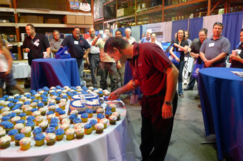 Vice President Alex Gonzalez cake cutting ceremony at Techni-Lux 20th Anniversary Open House 2010, Orlando, Florida USA