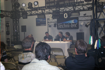 guest in showroom listening to a panel of guest speakers in showroom atTechni-Lux 20th Anniversary Open House 2010, Orlando, Florida USA