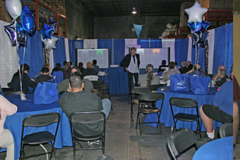 guests listening to guest speaker Phil Watson seminar on ChamSys controllers in warehouse Techni-Lux 25th Anniversary Open House 2016, Orlando, Florida USA