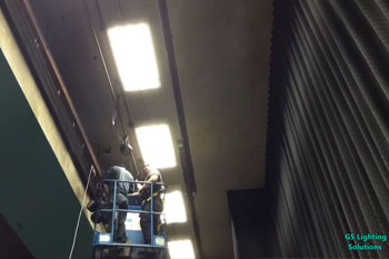 people on lift installing Techni-Lux Ultralux LED C7 fixtures above stage                                inside Calvary Baptist at the Liberty - Ellensburg, WA