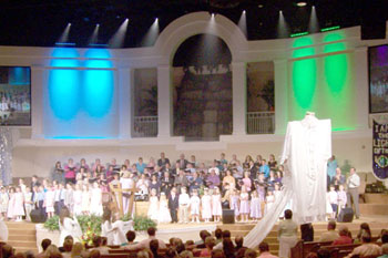 front view of stage with magenta pink LED wash on wall at East Coast Believers Church, Casselberry, FL, USA