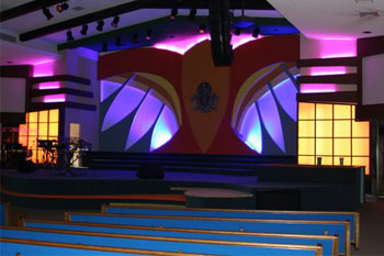 vibrant LED color washes of yellows, purples, aqua blues behind stage, International Tabernacle, West Palm Beach, FL, USA