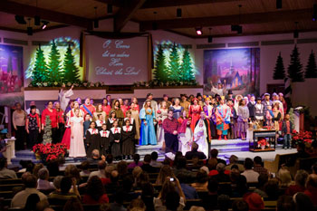 pattern gobos over trees with angels in back of stage and singers in front -Journey to the Manger Musical - South Orlando Baptist Church, Orlando, FL, USA