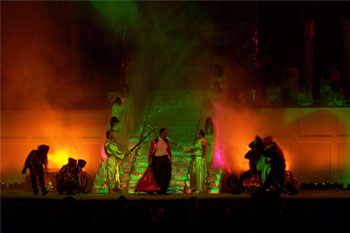 stage scene close up of the Devil and his demons trying to go up stairway to heaven while two angels on both sides block him with swords.The stairs have fog and LED light reflecting of the shimery green behind the people and simulated fire hell effect in Your Final Destination - Victory Church, Lakeland, FL, USA