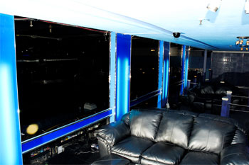 illuminated blue panels in a lounge with black couches, Aqua Lounge, Daytona Beach, Florida