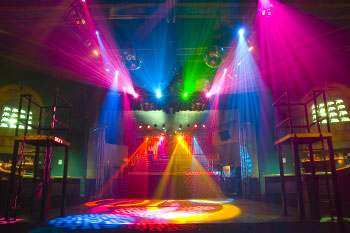 dance platforms on each side on dance floor, corner walls have video 16 monitor with abstract white and black imagery, mirror balls, beams of light in vibrant hues of pink, green, blue and vibrant beams of blue, yellow and pink lights with gobo geometric patterns on dance floor inside  Tabu - Orlando, Florida, USA