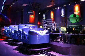 Interactive dark ride Justice League: Battle For Metropolis 4D building ride loading queue at Six Flags Theme Parks, U.S.A.