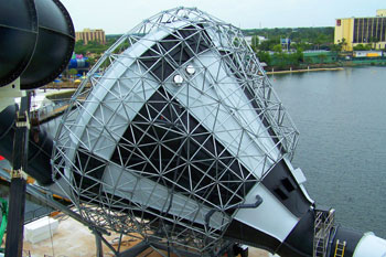 black and white checkered pattern with geometric triangular metal patterns around the funnel portion of Brainwash Water Slide, Wet 'n Wild - Orlando, Florida, USA