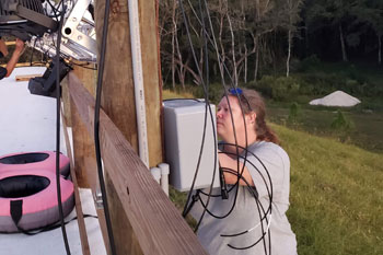 electrical specialist Lisa Hansen working on cables and boxes on Snow Slopes at Snowcat Ridge Alpine Snow Park - Dade City, Florida, USA