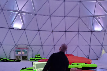 techni-lux in-house lighting designer, tony hansen programing white LED lights inside Artic Igloo at Snowcat Ridge Alpine Snow Park - Dade City, Florida, USA