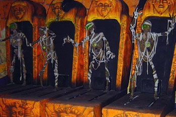 boo-up ancient eyptian skeletal mummies with glowing green eyes coming out of their tombs inside 