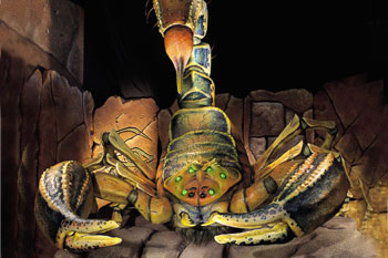 huge animatronic scorpion with glowing green eyes inside a crumbled temple inside Challenge of Tutankhamon Dark Ride, Walibi Belgium