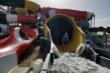 Techni-Lux Lighting Designer Tony Hansen walking out of Batman™ Water Slide, Parque Warner Beach - Madrid, Spain