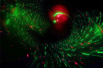 BLISS Light Custom Laser Unit  vibrant colors of green and red particles reflecting like a spiral along the the dark black walls of the water tube interior of the  Black Hole Water Slide, Wet 'n Wild - Orlando, Florida, USA