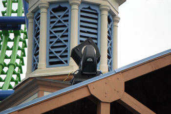 1 Studio Due City Beam 1800 architecural lighting fixture on guest ride loading roof pointed up towards Goliath Coaster Thrill Ride, Goliath Coaster Thrill Ride, Six Flags New England - Agawam, Massachusetts, USA