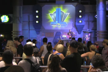 guests in queue line listening to Cyborg a animatronic, Justice League: Alien Invasion Warner Bros. Movie World - Gold Coast, Australia