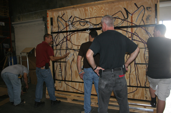 Mayor Slayor animated Custom Ropelight Sculpture being put into a crate by workers and Techni-Lux employees Robert Ramos and Tony Hansen in Techni-Lux warehouse -LightmosFEAR - Fright Fest, Six Flags New England - Agawam, Massachusetts, USA